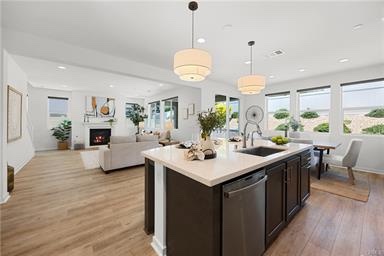 Bright open-concept kitchen and living space at 32246 Hillstone Street