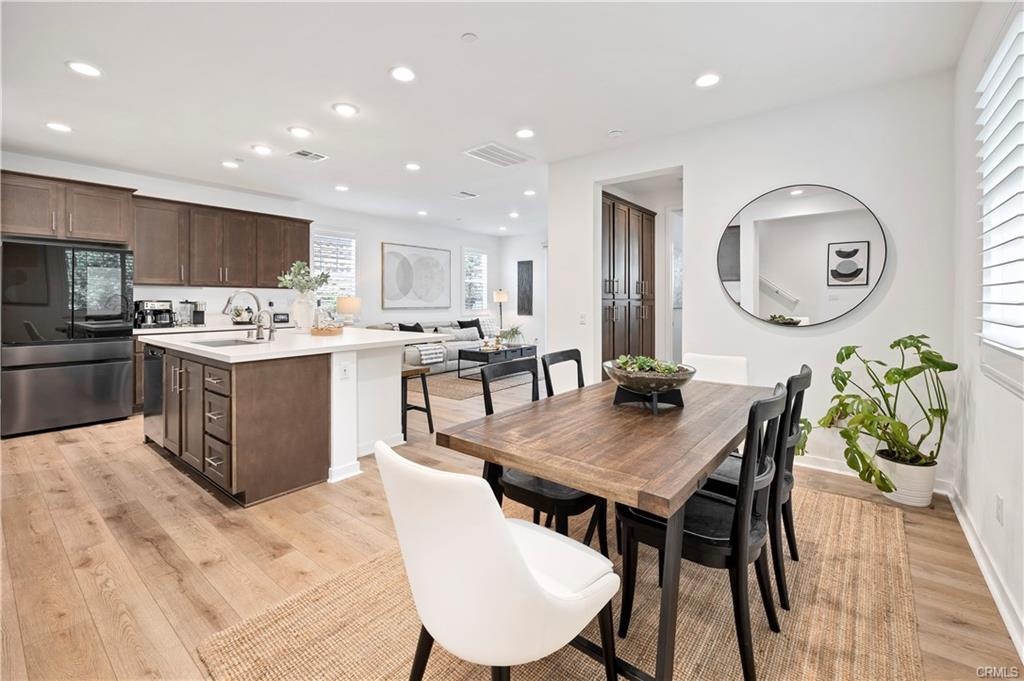 Open-concept kitchen, dining and living space at 32664 Brunello Way