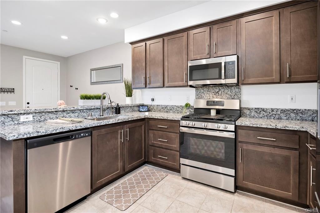 Warm contemporary kitchen at 39315 Corvina Lane