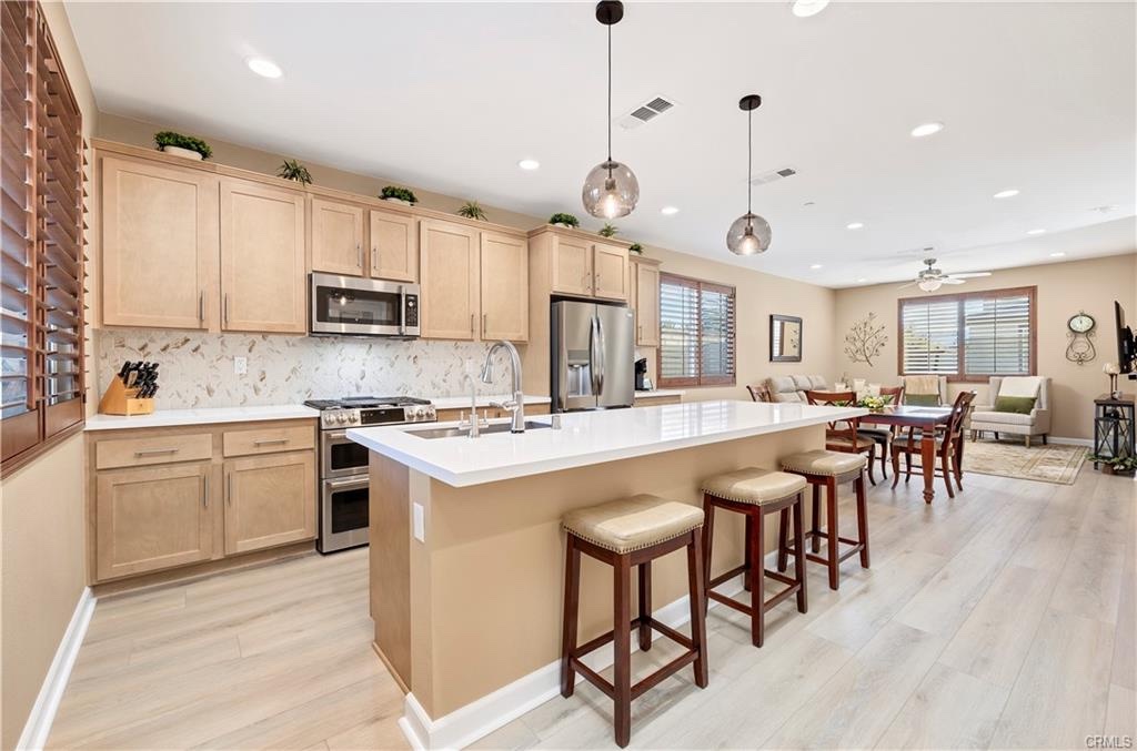 Warm modern kitchen at 39320 Brunello Way