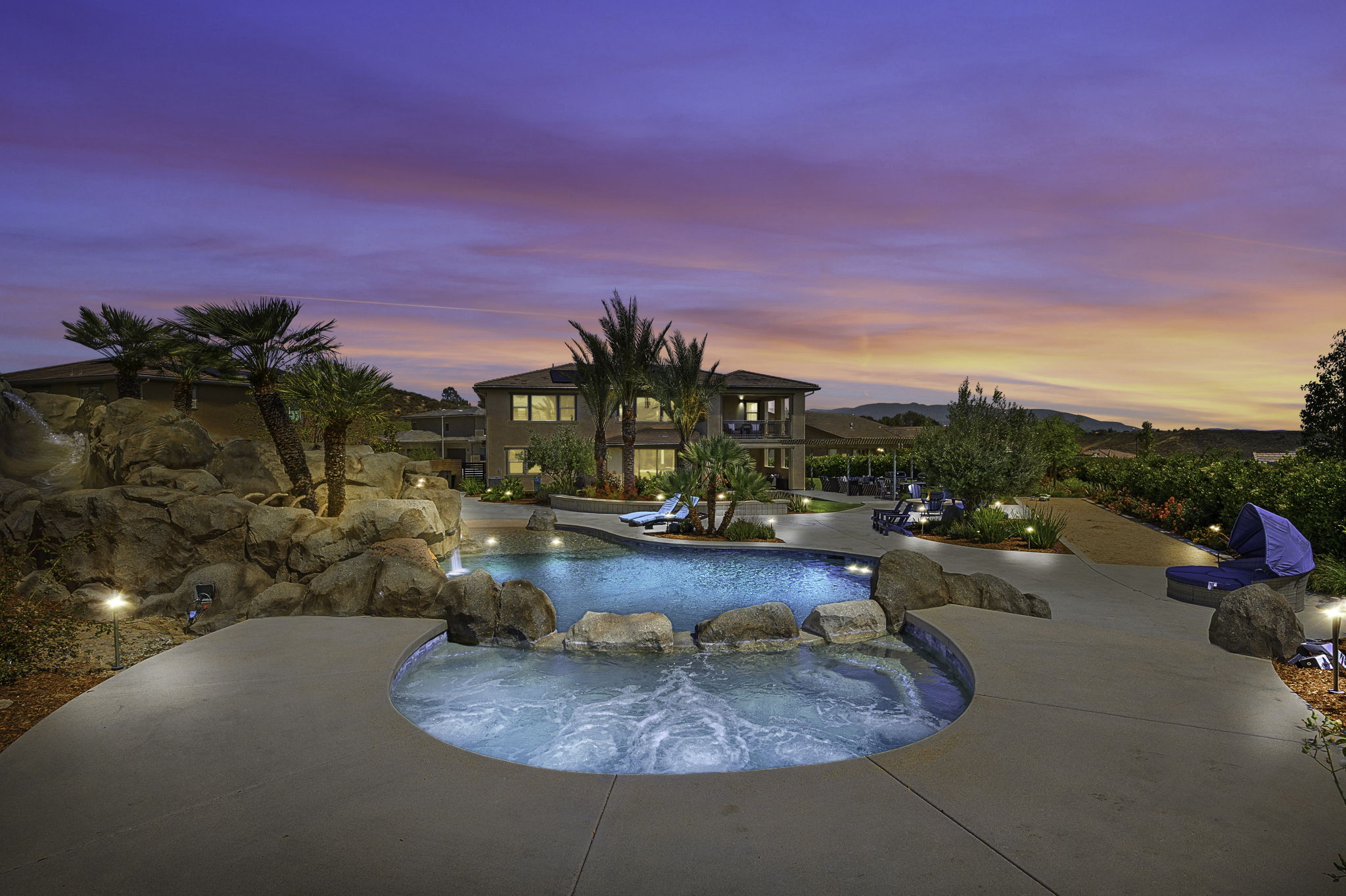 Resort-style pool and spa at sunset at 39707 Larkspur Terrace